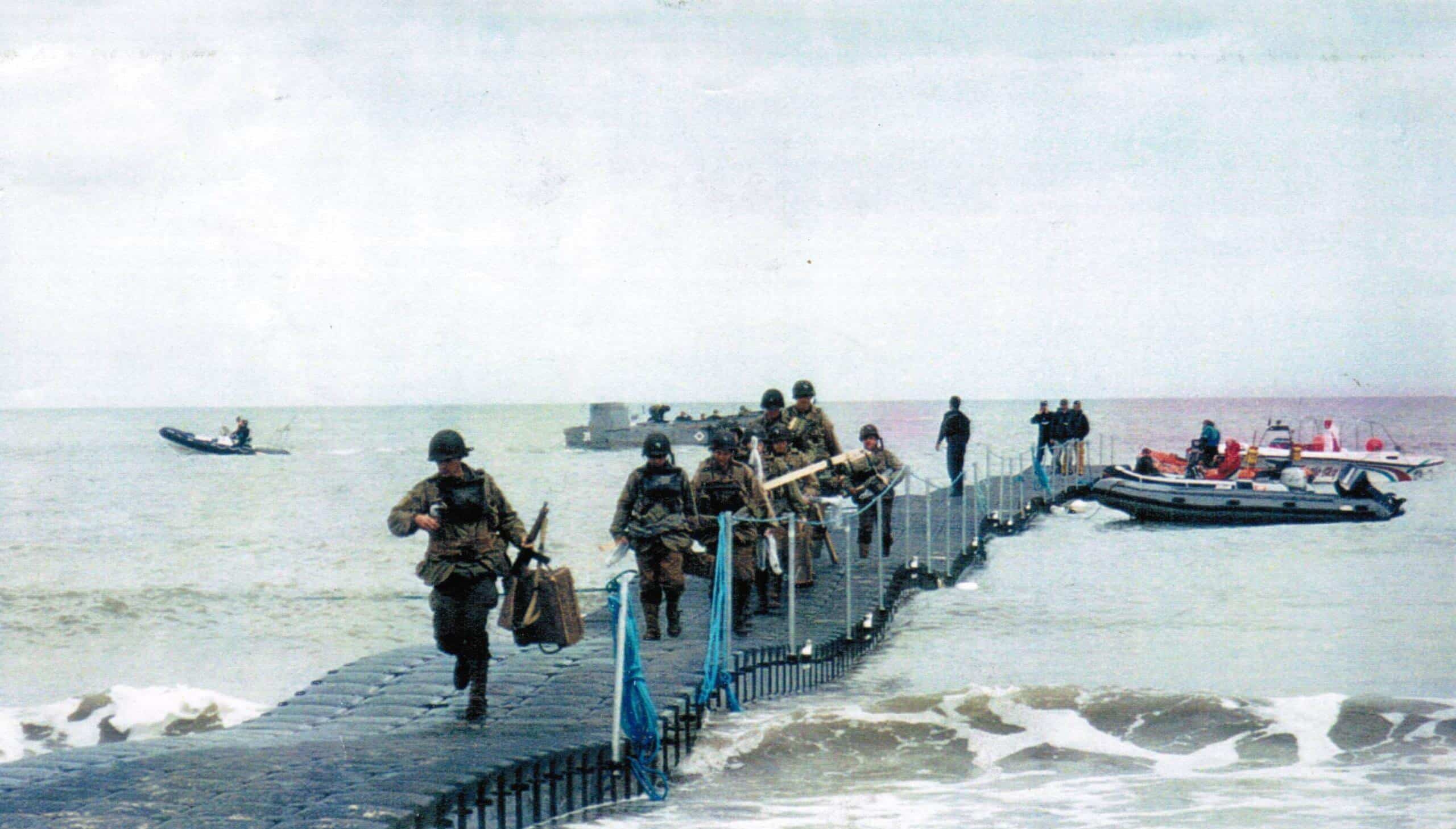 Military running across a pontoon bridge