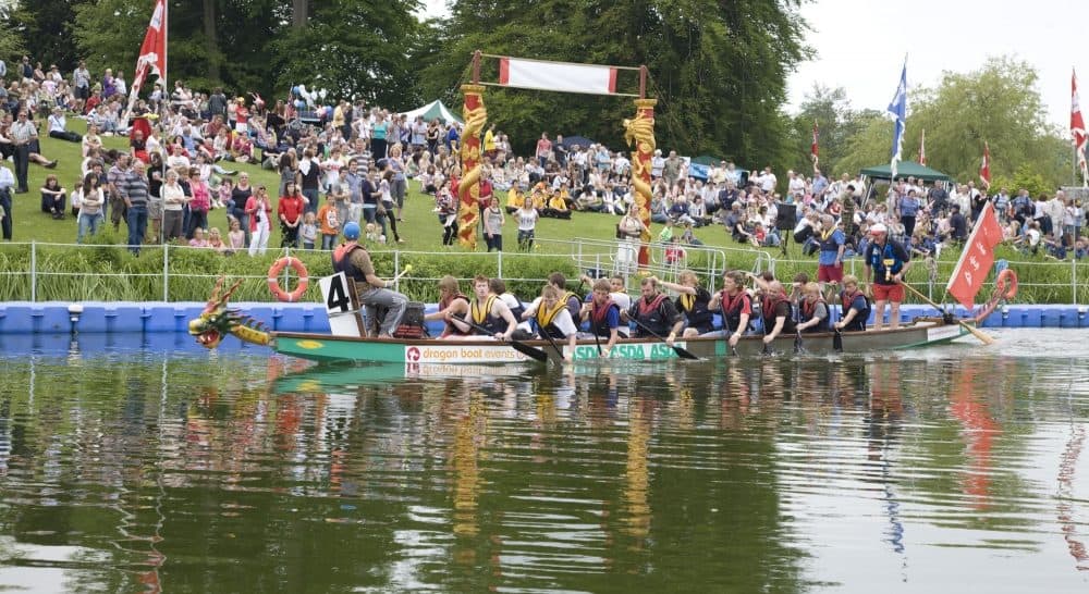 Sherborne Dragon Boat Racing event on a river with floating pontoons as starting and finishing line