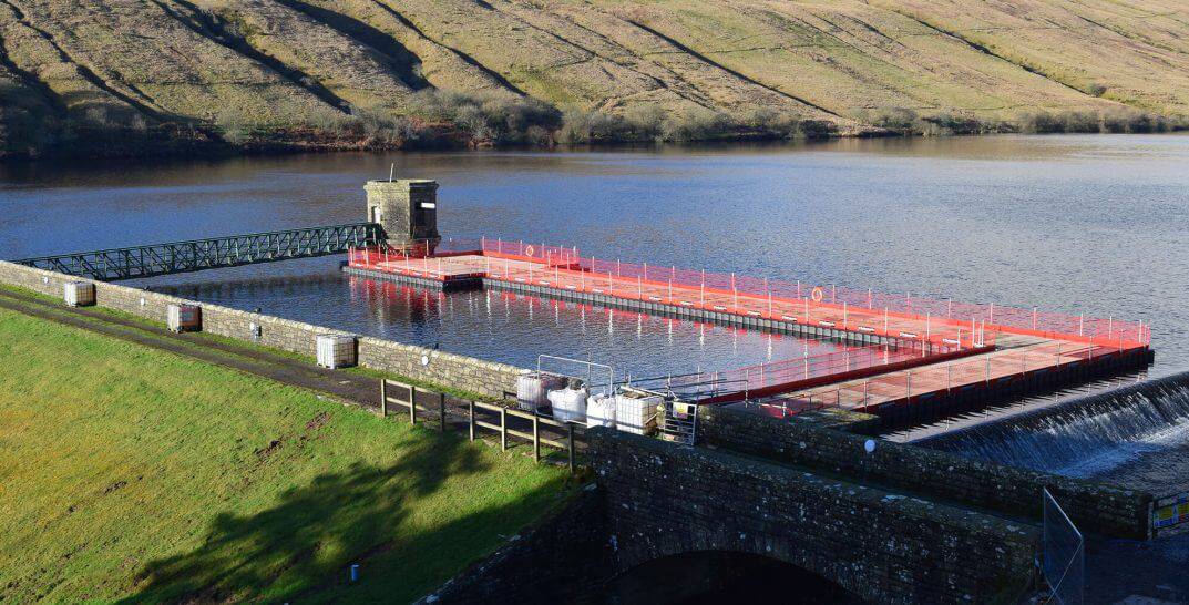 Reservoir intake tower repairs using modular pontoon