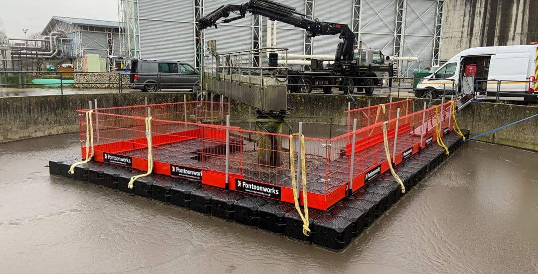 A floating pontoon used as a work platform for the maintenance of water treatment facilities